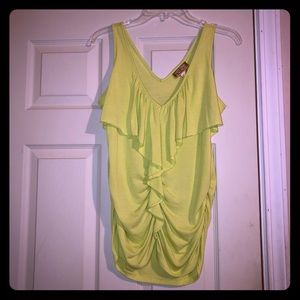 Sleeveless Deep-V blouse with layers and gathers.